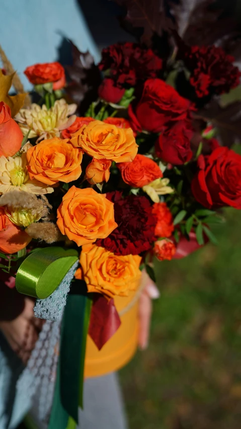 there are many colorful flowers that are on this hand