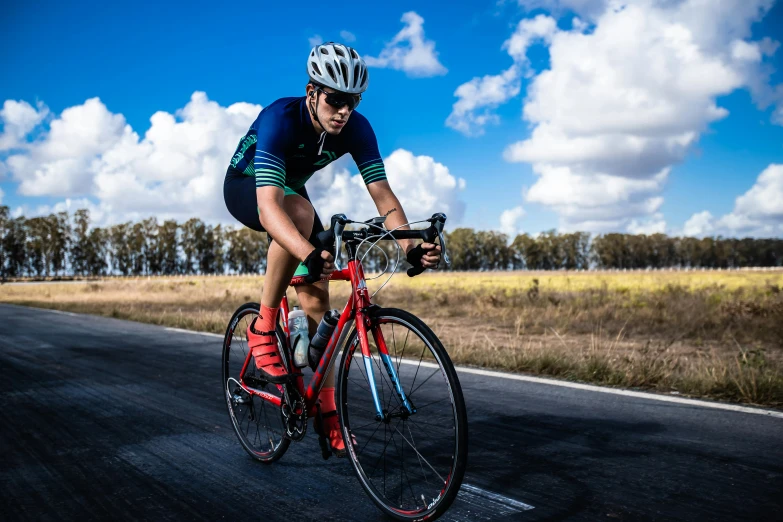 a man riding a bike down a curvy road