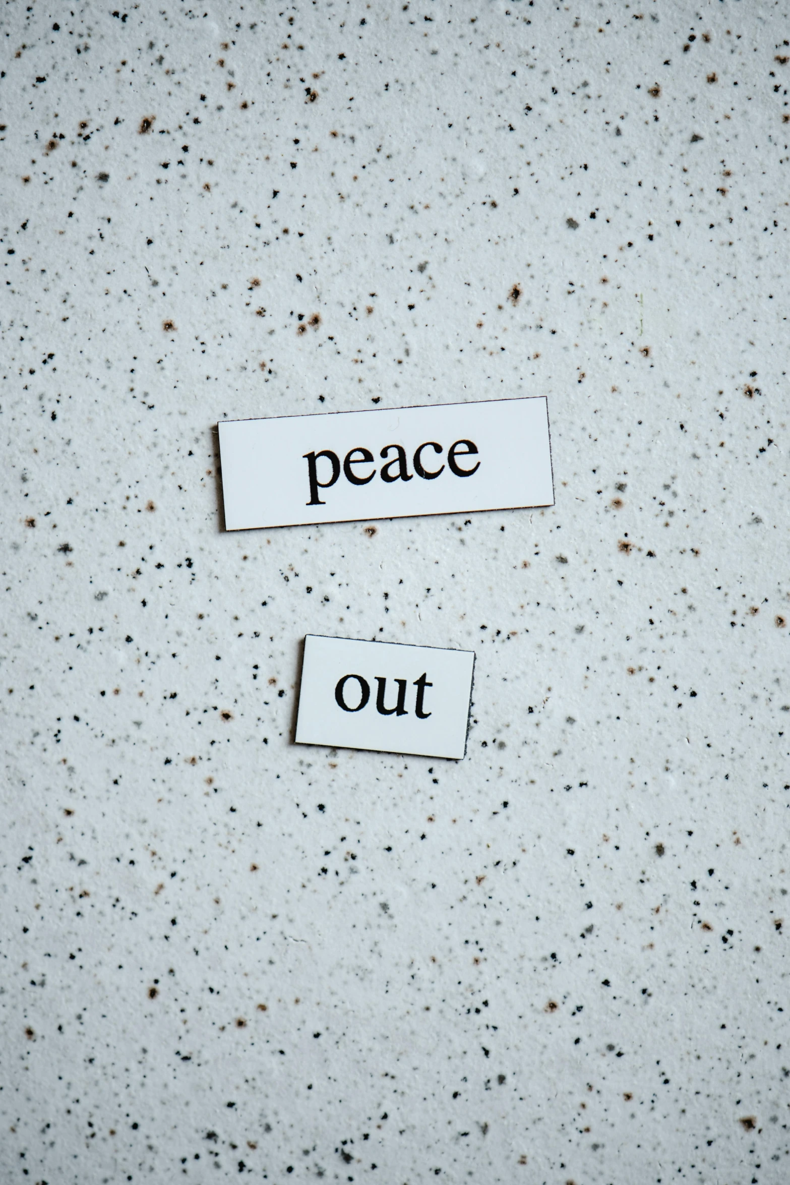 two pieces of paper that say peace and out