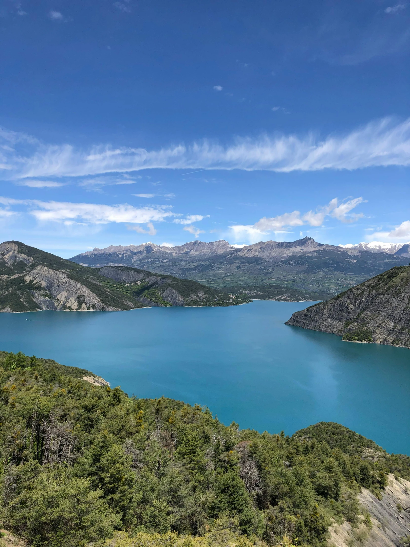 there are many mountains, trees and water in the area