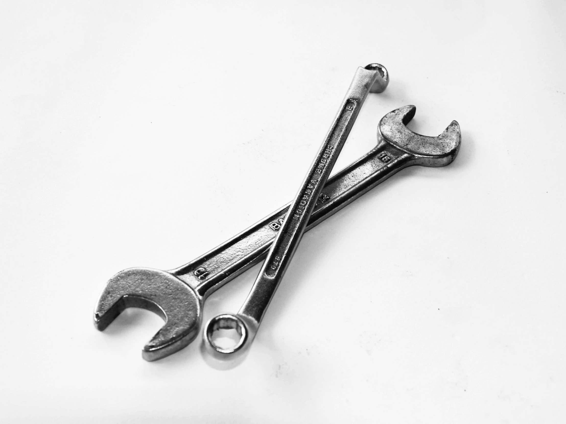 two wrenches are placed on the table