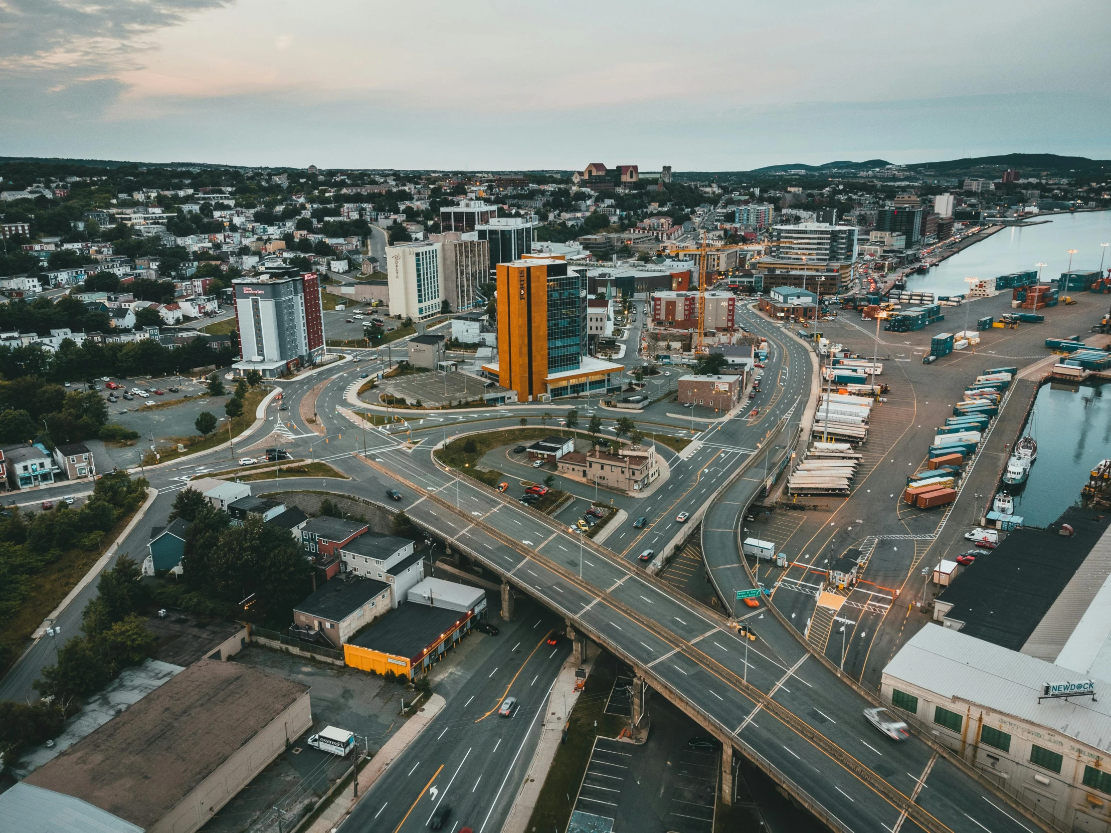 an aerial view of a city intersection with an overpass