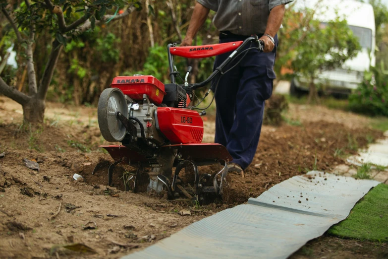 a man that is standing in the dirt