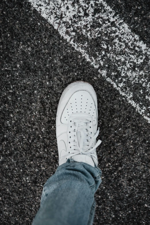 a close up view of someone's shoes on the ground