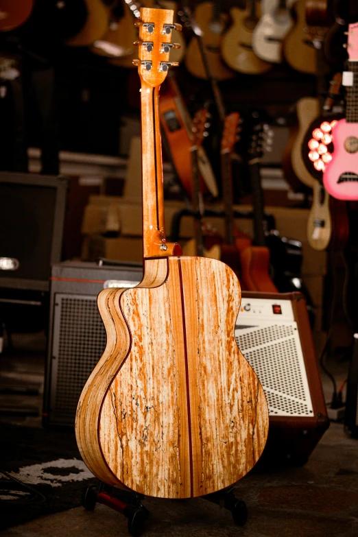 the guitar stands with guitars in the background