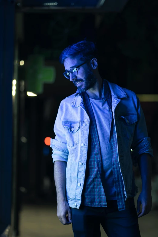 man standing in a dark room by himself