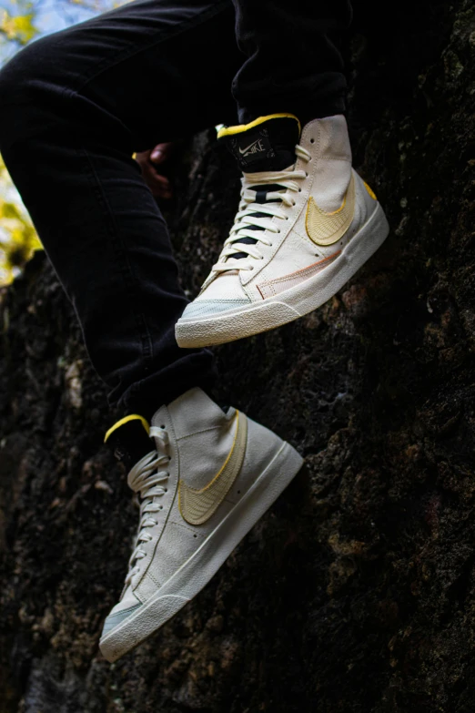 a person standing on the side of a cliff with their feet up