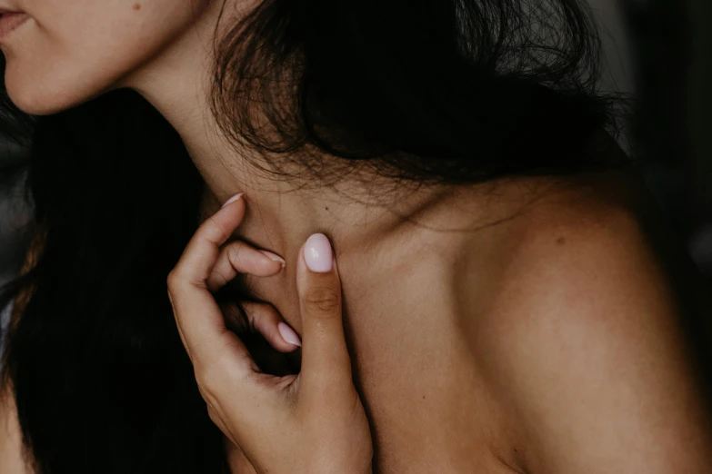 closeup of woman holding  cancer sign with one hand