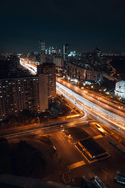 an urban scene at night in a large city