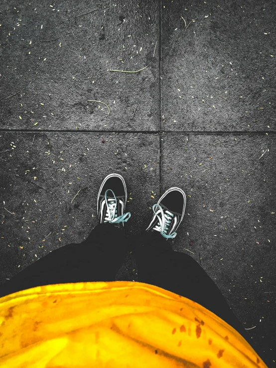 a person standing on top of a sidewalk