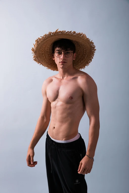 a shirtless male posing for a picture