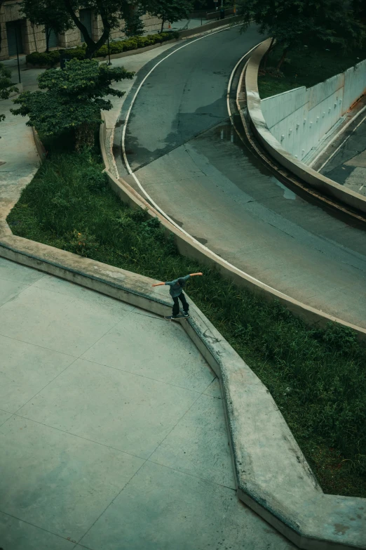 a person on a skate board, some stairs and a road