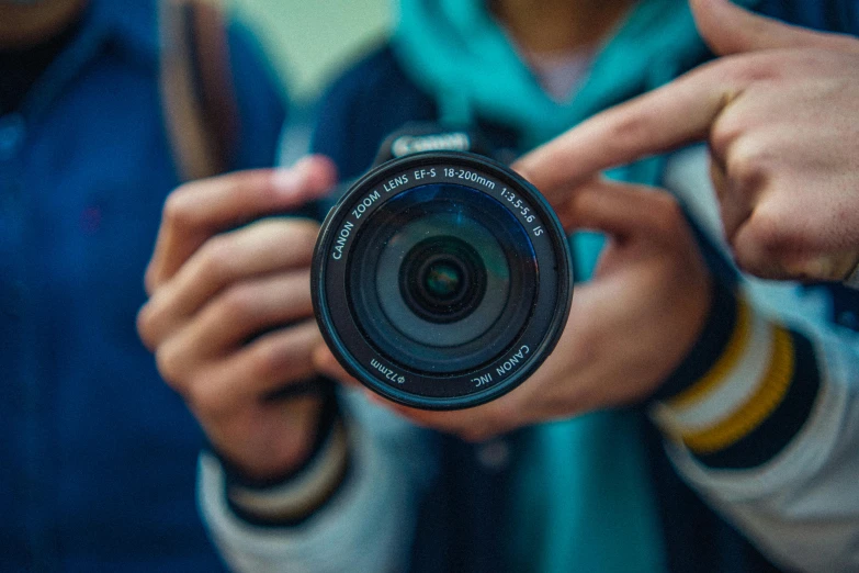 three people taking a picture with their camera