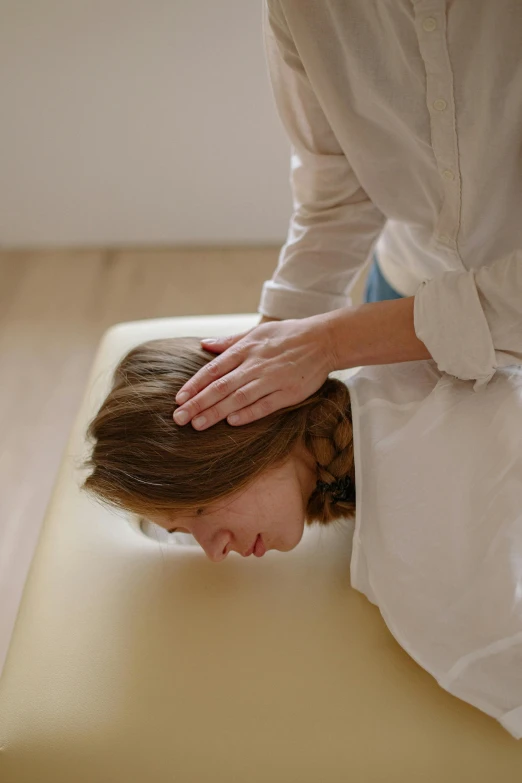 a woman with her head placed on the surface