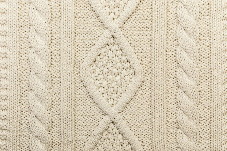 an image of a large white knitted cloth