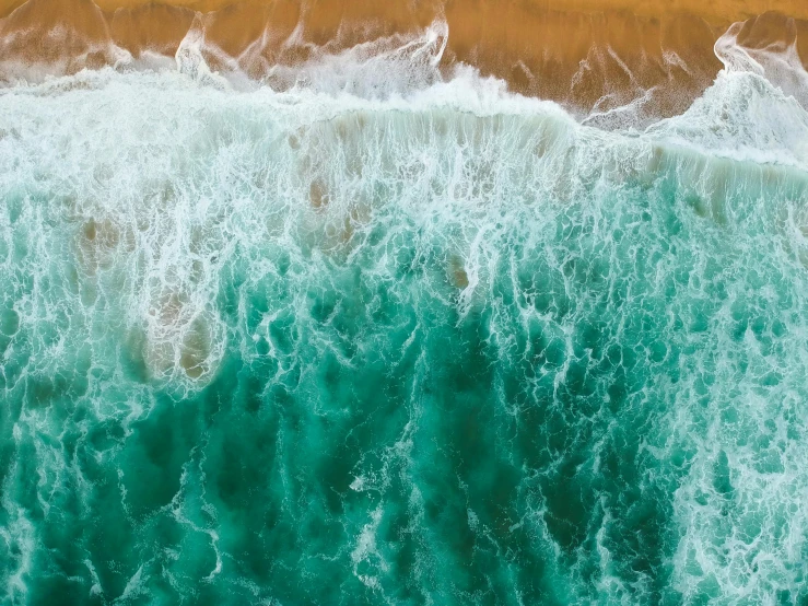 a body of water with waves next to it