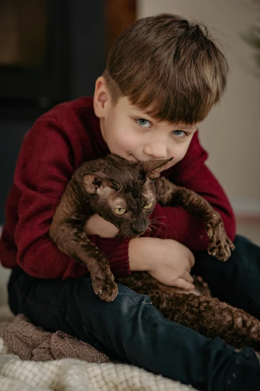 a  holds a cat on his back