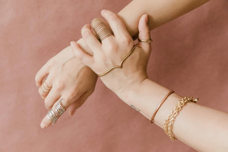 closeup of two people's hands holding on to each other