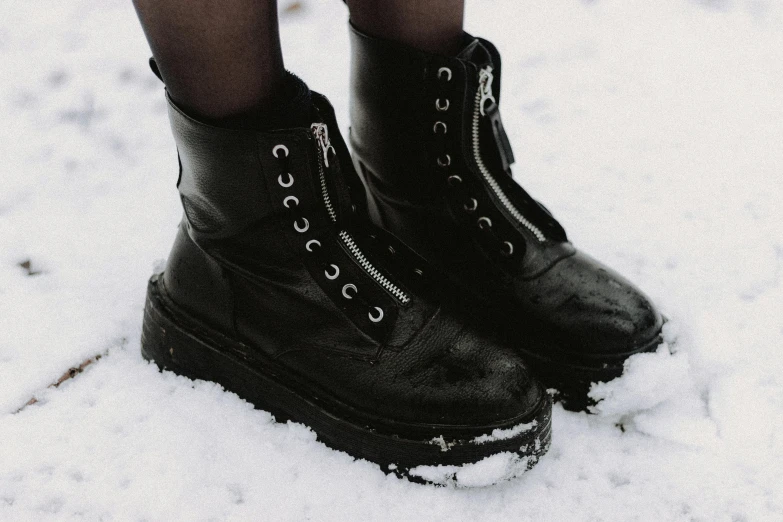 black and white pograph of woman in boots