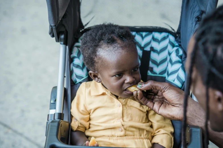 an image of a woman feeding her child