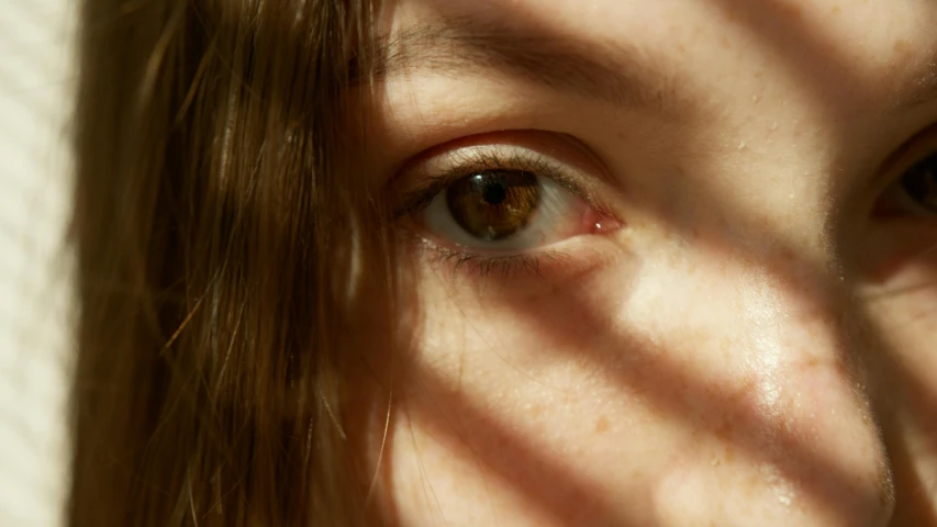 close up view of a person's eyes and eyeshade