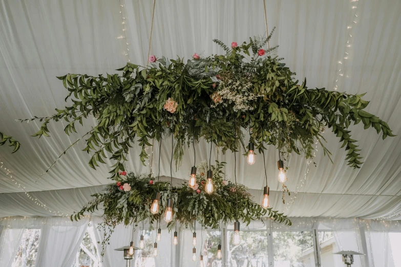 a very fancy looking room with flowers and lights