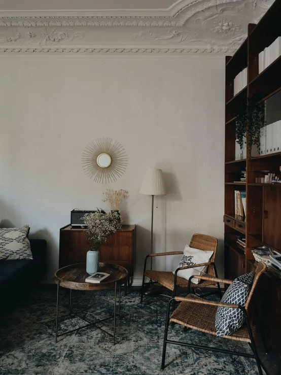 a living room with furniture on the floor and a sofa next to a fireplace