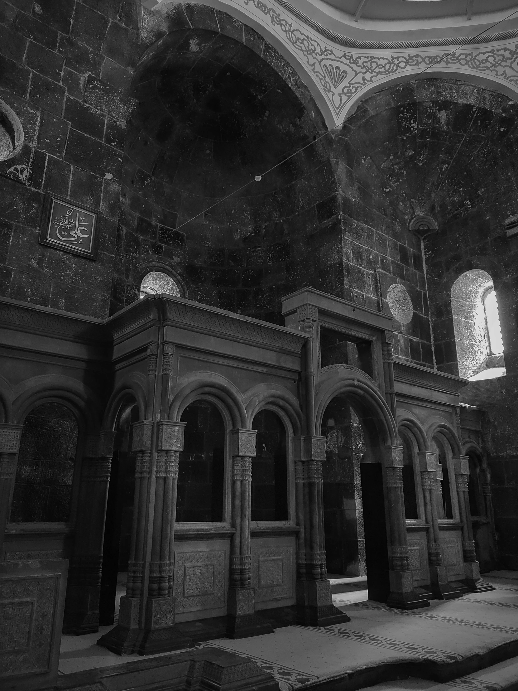 the interior of an old cathedral with many arches and arches