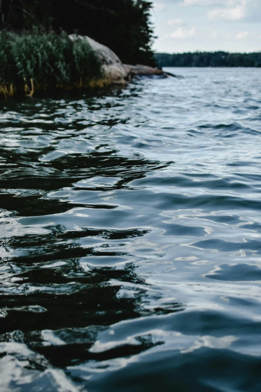 a person is paddling their canoe in the water