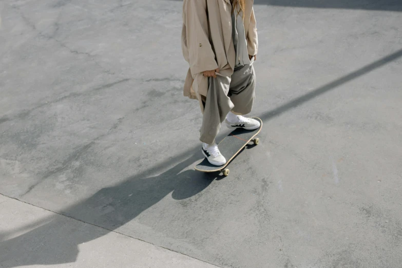 an old lady skateboarding on the pavement with no shoes