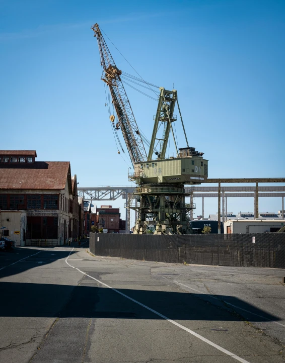 the cranes are standing in the industrial zone