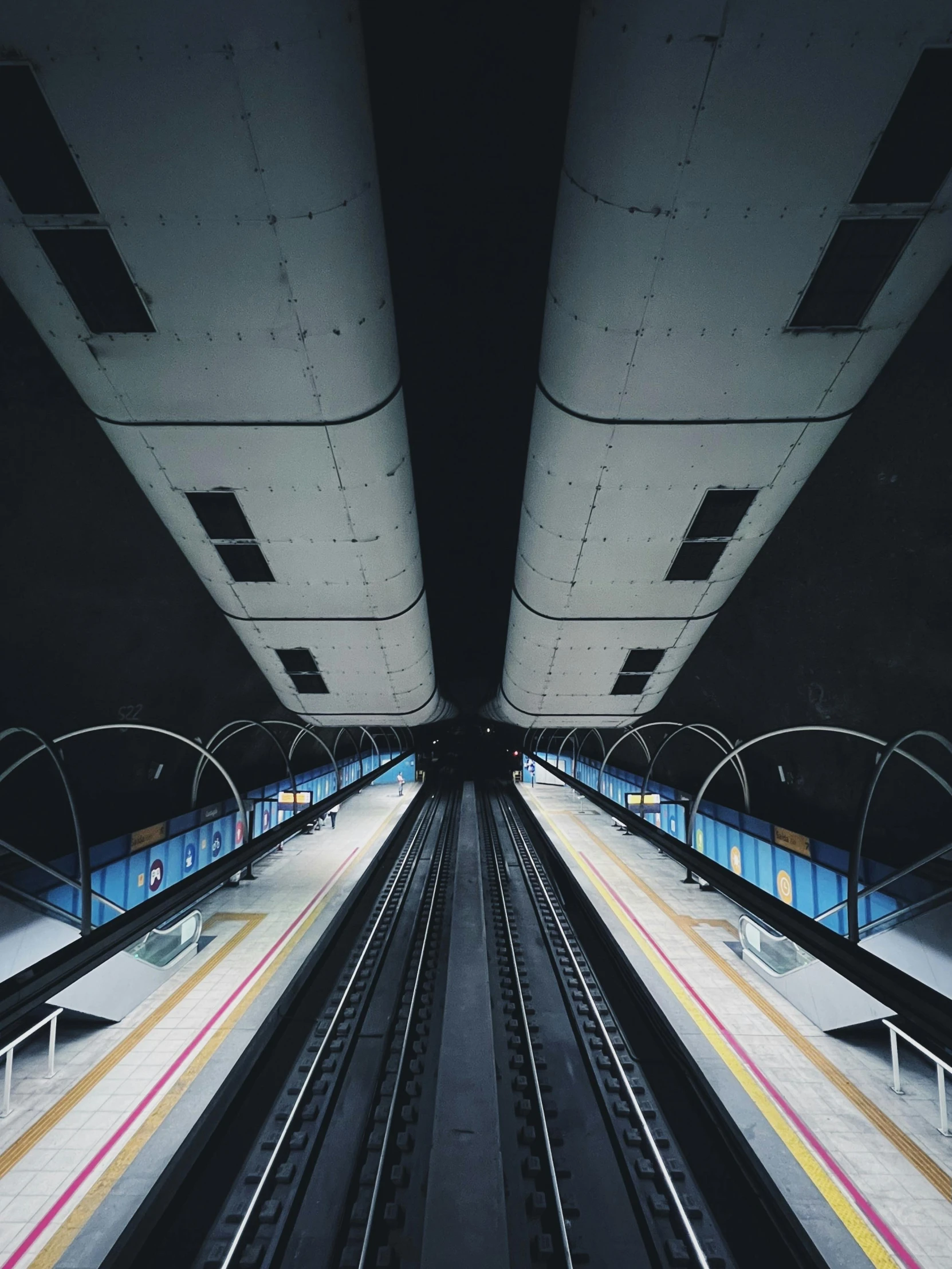 several commuter tracks in a subway station in europe