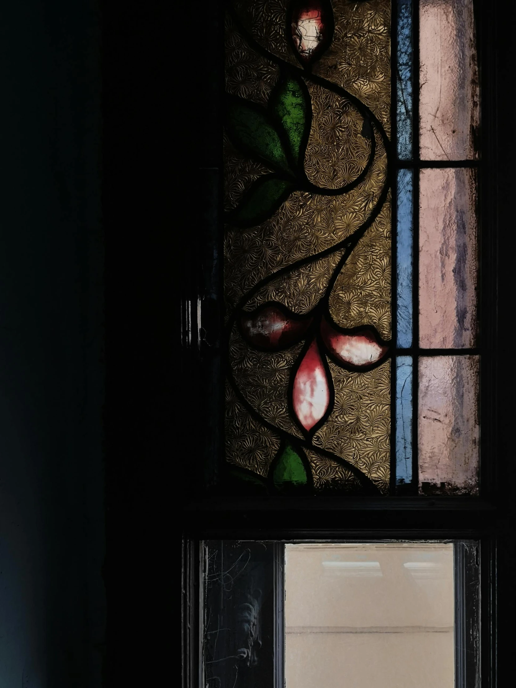 a window that has a flower painted on it