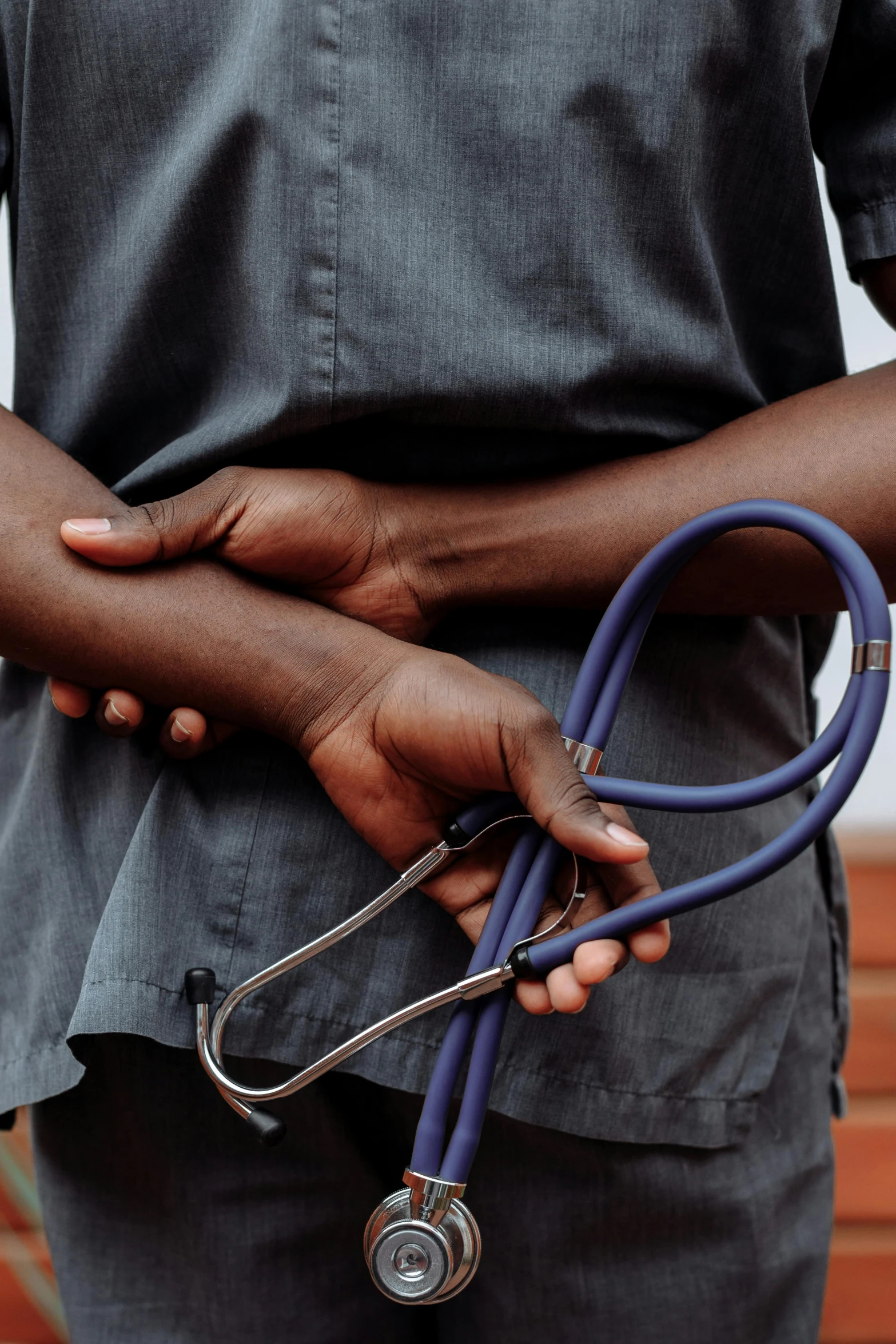 a black male with a stethoscope in his hands