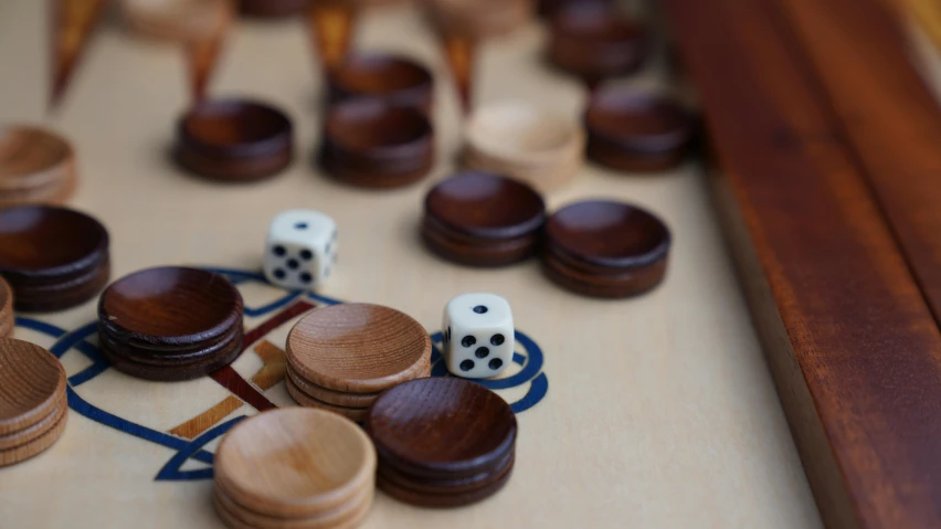 a wooden board game with dices and sets