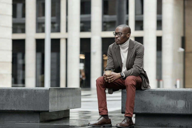 a man sitting down with his head down