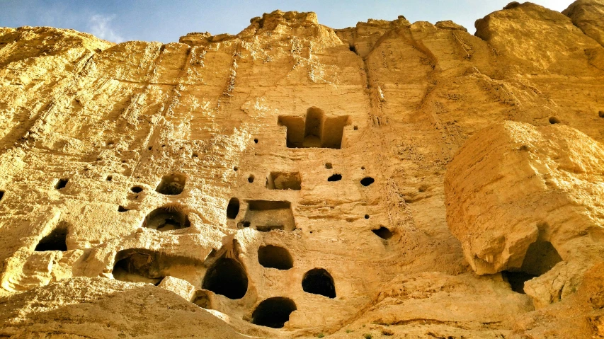 the large rock formations have holes that are above them