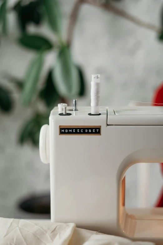 a close - up of a sewing machine sitting on top of a table