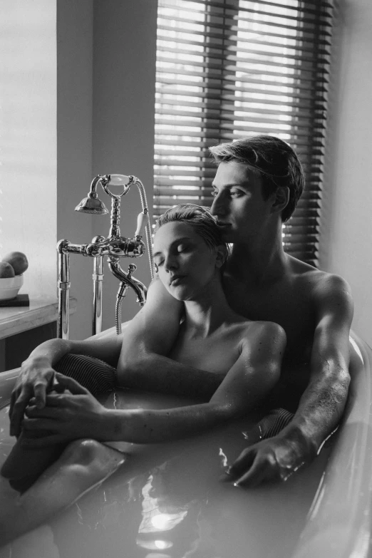 a couple taking a bath in the tub