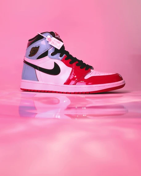 a pair of sneakers with pink and blue shoes