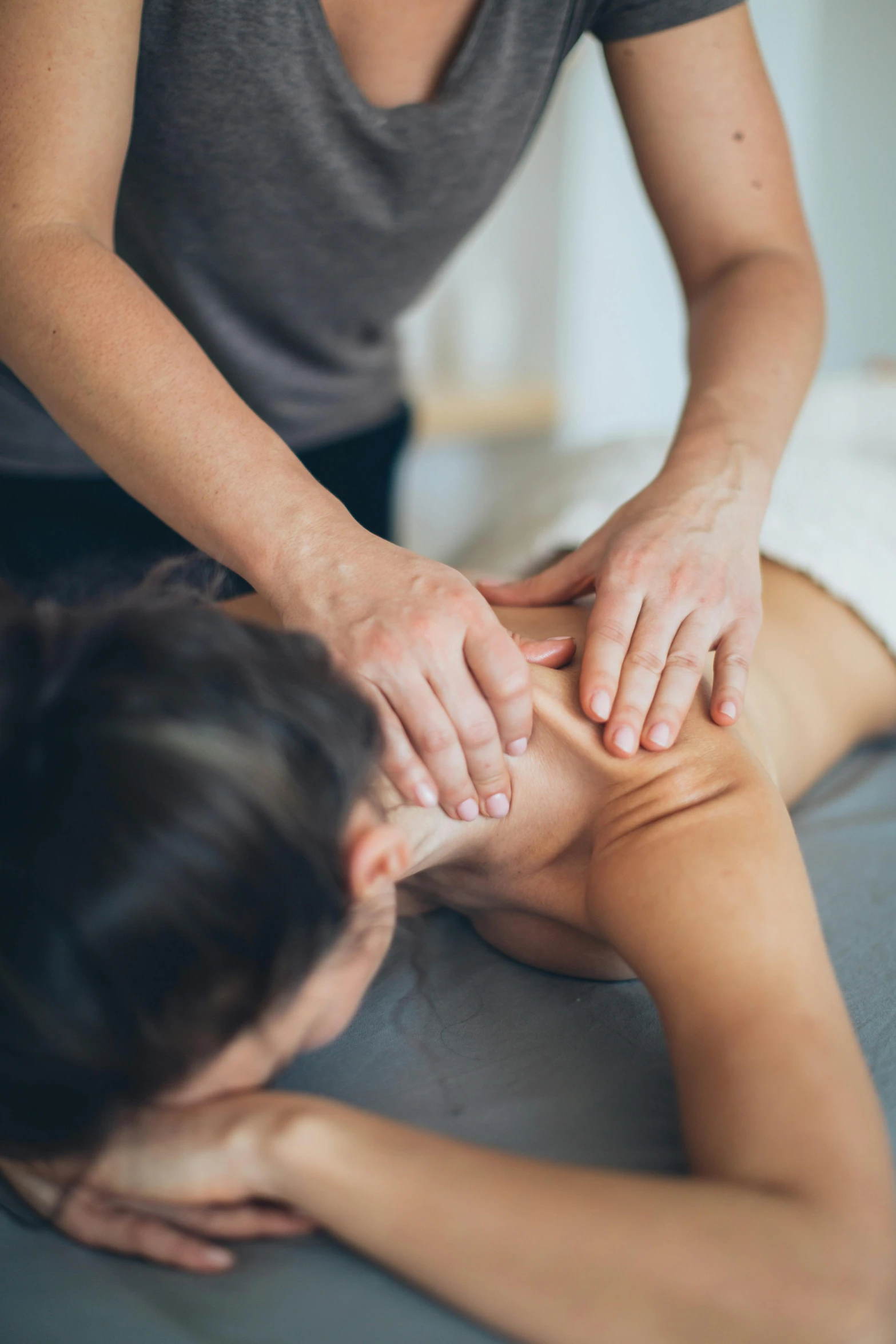 the lady is doing a massage for the back