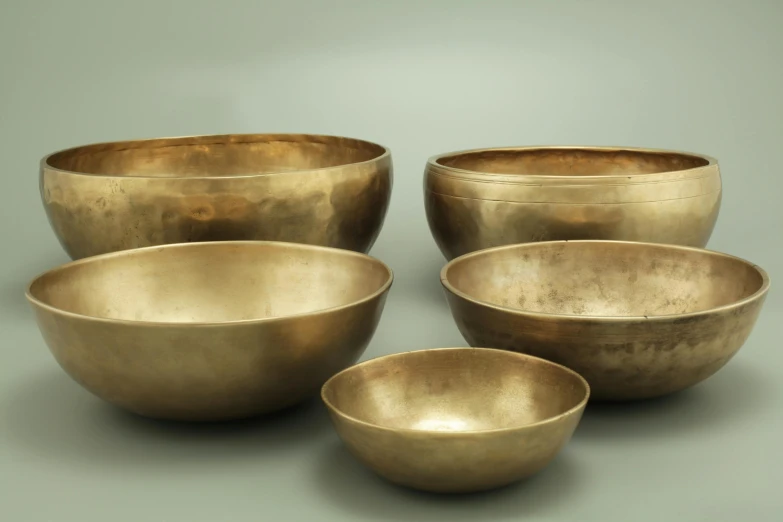a set of four large bowls made in gold