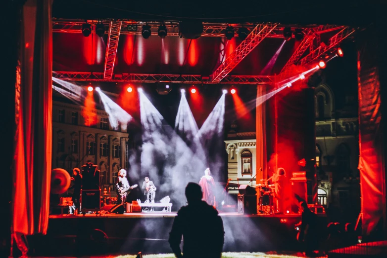 concert lights on a stage with man looking at him