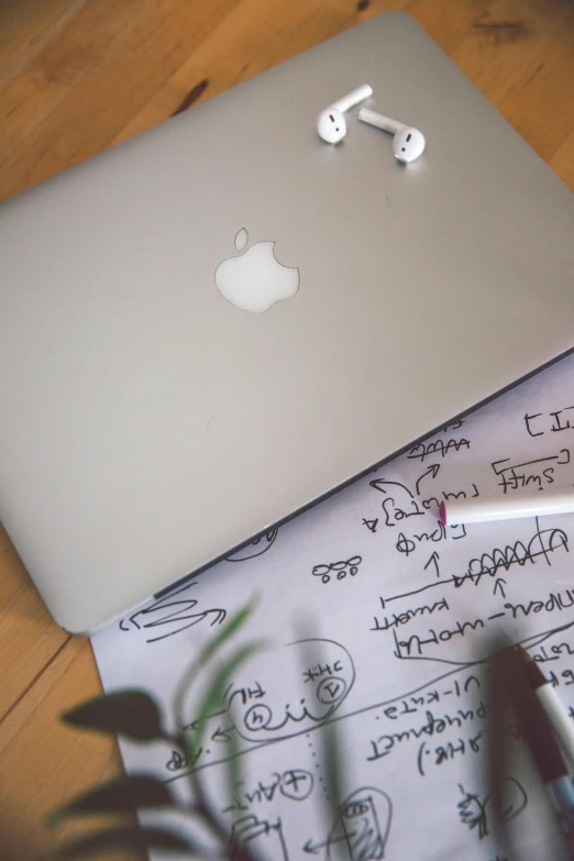 two different types of laptops sitting on a desk