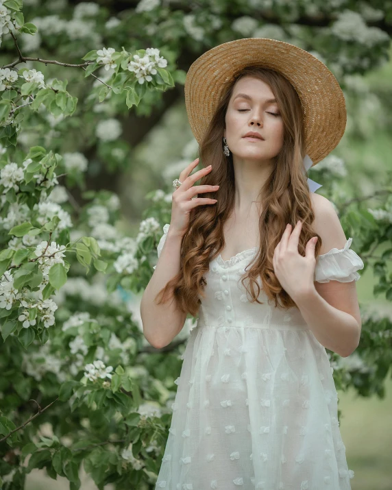 a girl with her eyes closed posing for the camera