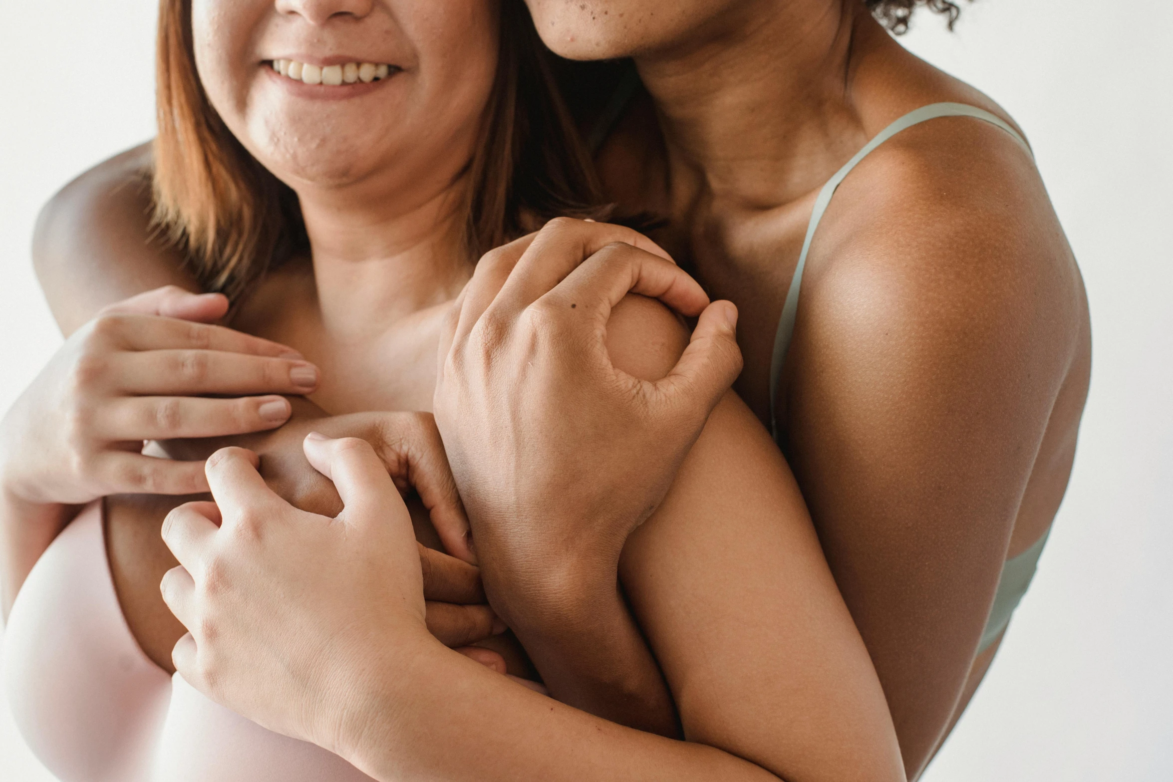 an older woman is hugging the younger one