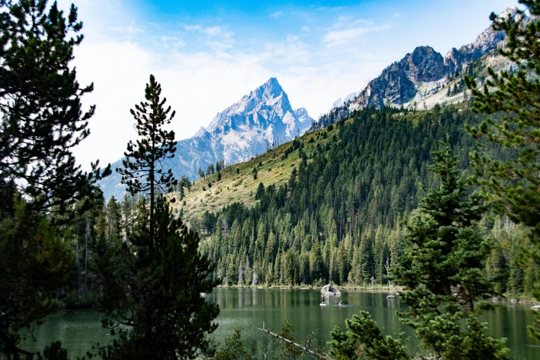 the mountains are shown by a body of water