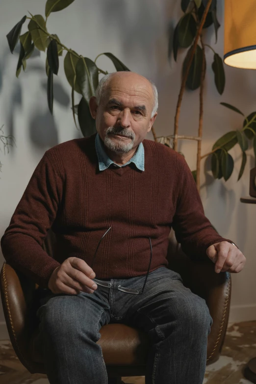 an older man is posing for a portrait