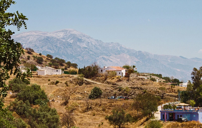 a small hillside side village is near mountains