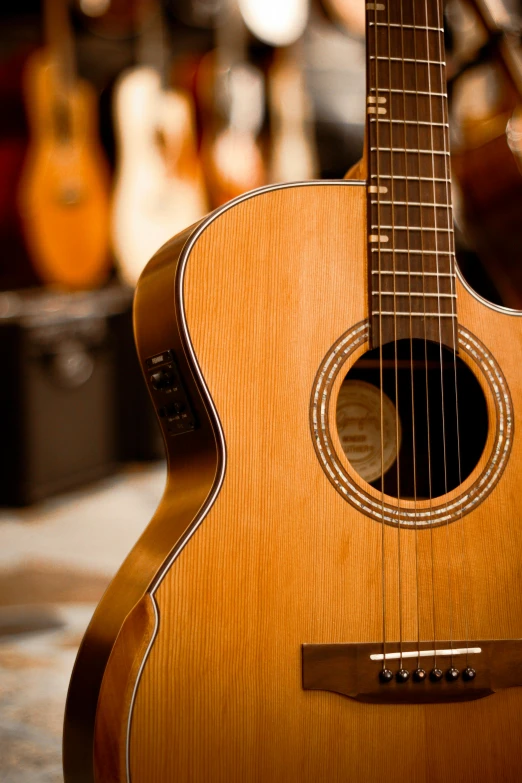 an acoustic guitar is shown with other instruments